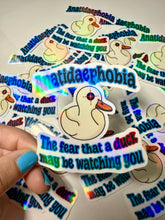 Cargar imagen en el visor de la galería, Anatidaephobia Vinyl Sticker- Holographic - Handmade - Ducks- Phobias- Funny